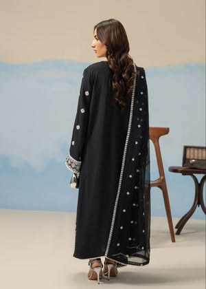 Women's 3-piece black winter suit, back view long tunic with white print and edge trim