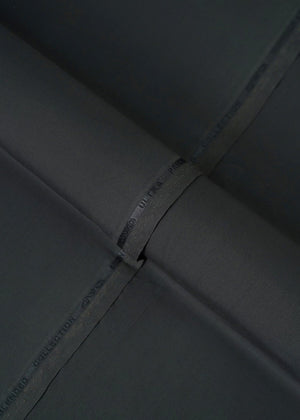 Black fabric with stitched seam and printed label on the edge