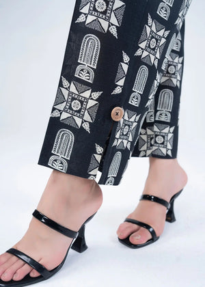 Wide-leg pants from the women’s co-ord set, black with white geometric print and button detail
