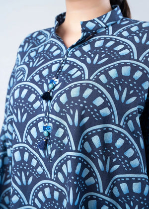Women's printed co-ord set close-up: navy collar placket with tassel ties