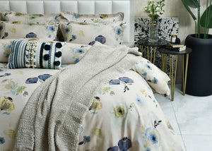 Cotton pale quilt cover with blue and yellow floral print, shown with light textured fabric