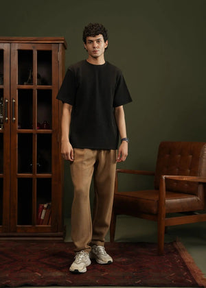Men's black waffle-knit T-shirt, front view, crew neck with short sleeves