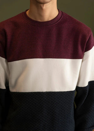 Maroon, white, and navy striped fleece crewneck sweatshirt front close-up.