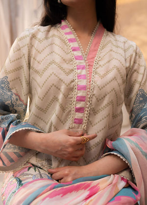Beige printed kurta with pink trim and lace-like neckline edge