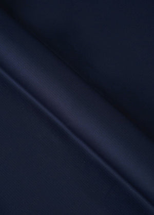 Deep navy dobby fabric with fine woven pattern, close-up texture