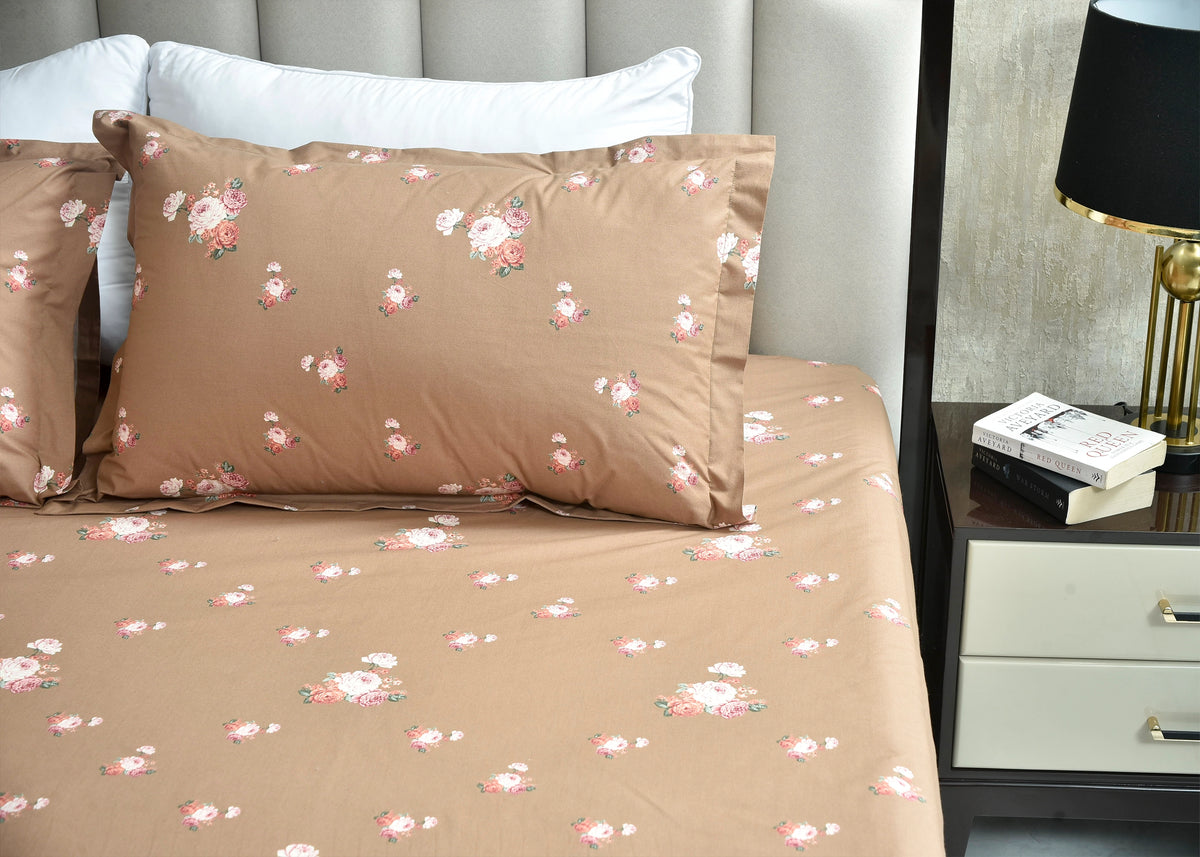 Coffee cotton bed sheet set with floral print, shown with two matching pillowcases