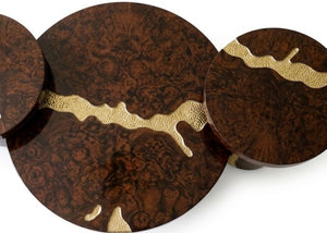 Round dark wood table top with gold brass inlay pattern and curved edge