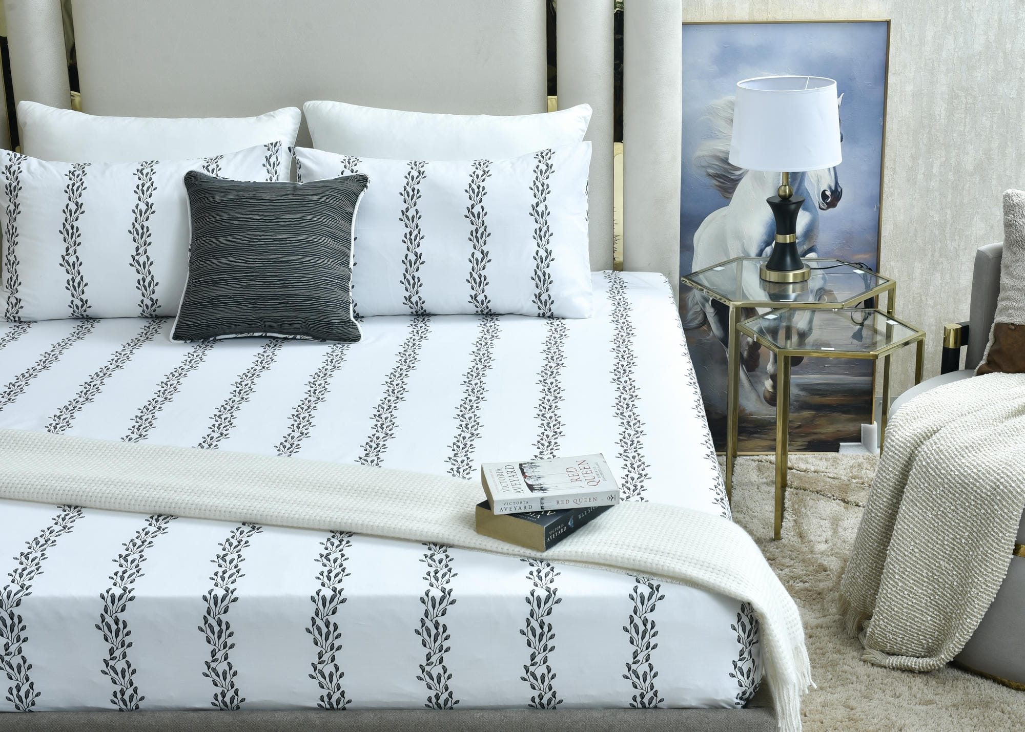 White bed sheet set with vertical leaf print and matching patterned pillowcases