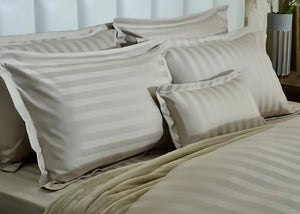 7-piece duvet cover set with beige striped duvet and multiple striped pillow shams