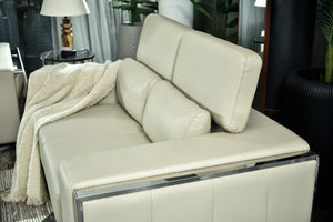Cream chaise sofa with padded backrest and armrest cushion