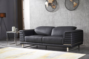 Black three-seat sofa with rounded back cushions and stacked horizontal panel stitching