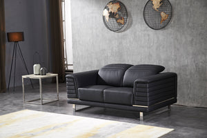 Black modular sectional sofa with curved back cushions and horizontal stitch detailing
