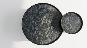 Round nesting tables with dark gray stone-look tops, smaller table nested