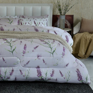 Lilac comforter set with lavender sprig pattern and beige quilted comforter layer