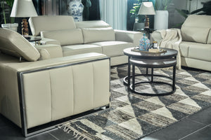 Cream upholstered sofa set with armrests, removable cushions, and round coffee table view