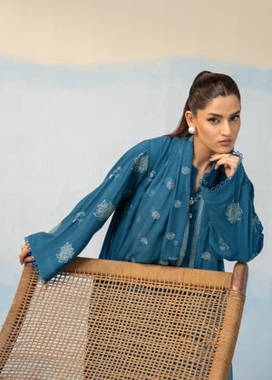 Women's blue embroidered 3-piece suit close angled view with dupatta over shoulders