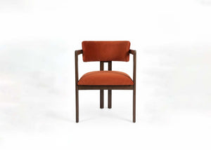 Wood dining chair with orange upholstered seat and back