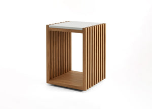 Wood end table with open slatted sides and white top panel