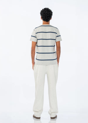 Men's summer night suit, back view: blue striped crew T-shirt with light pants.