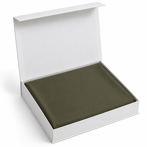 Olive ready-to-stitch fabric, folded in open white box