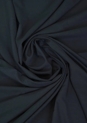 Dark black wash-and-wear fabric swirl with soft, smooth texture