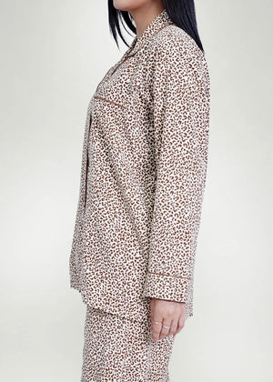 Men's silk night suit in light tan and brown leopard print, button-front top.