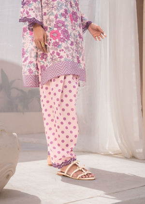Women's 2-piece set with pink polka-dot pants and floral tunic hem; flat sandals