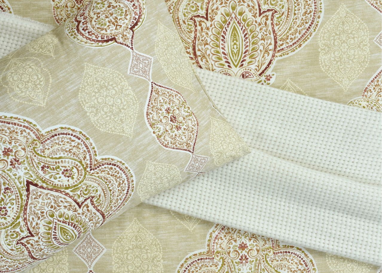 Light seafoam bed sheet with ornate gold paisley medallion pattern and white check texture