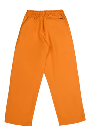 Girls' orange pull-on trousers with elastic waistband and side pockets