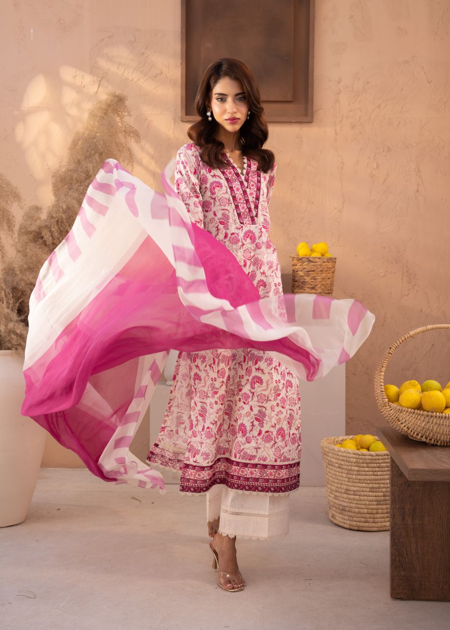 Pink floral tunic and sheer dupatta draped over shoulders, ankle-length pants