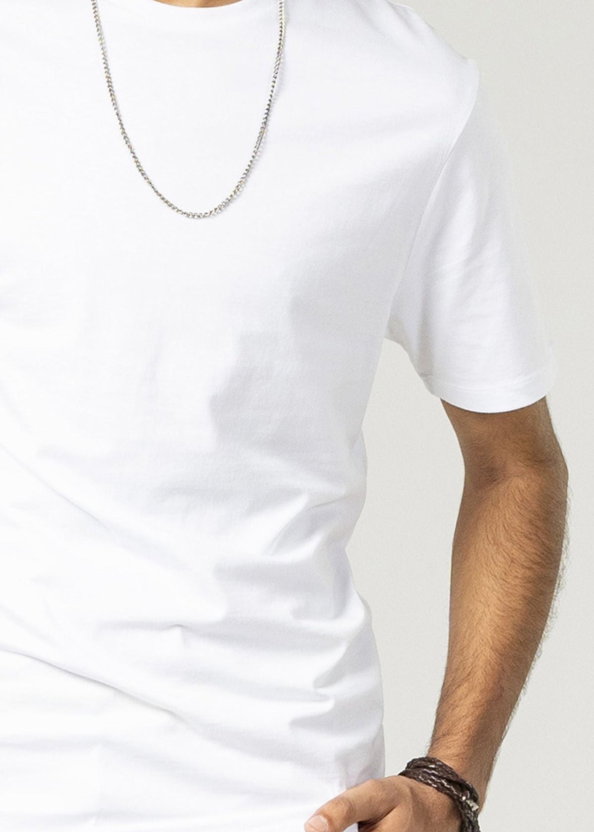 White men's round neck short-sleeve T-shirt, close-up of chest and sleeve