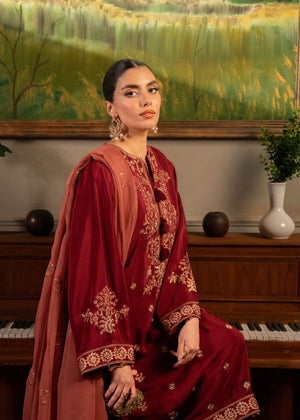 Women's maroon embroidered kurta and dupatta with ornate gold detailing and pants