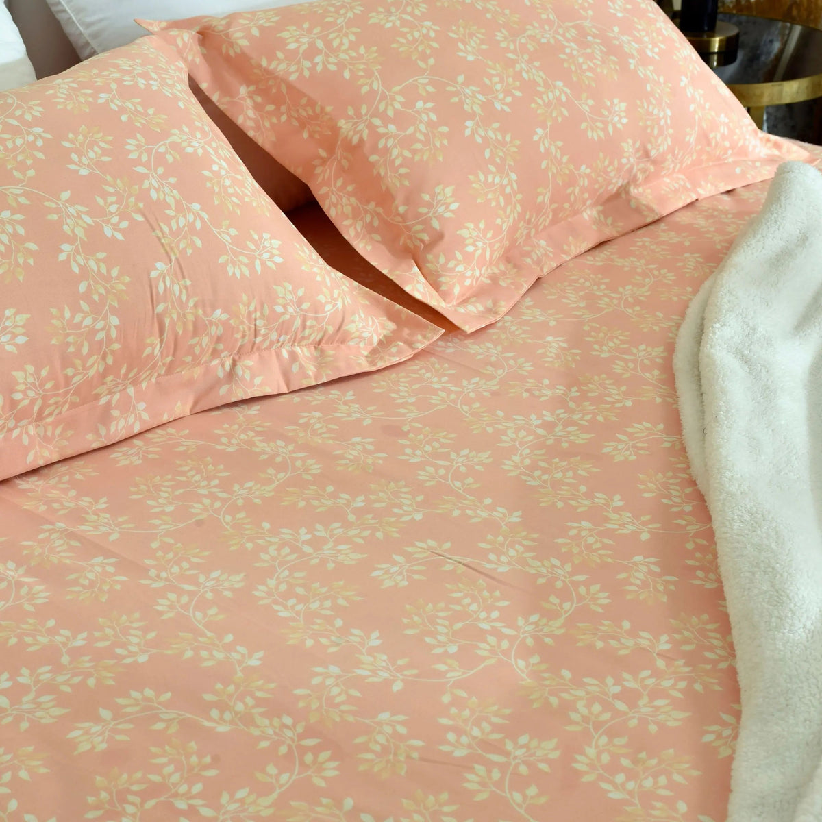 Peach floral vintage bed sheet set with matching pillowcases, microfibre fabric close-up