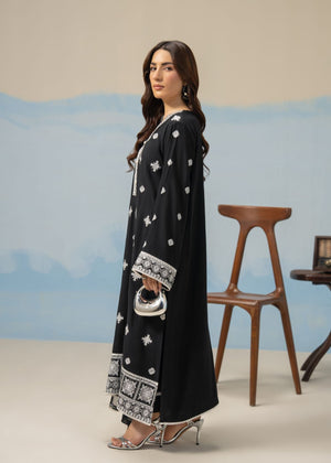 Women's 3-piece black winter suit, front view long tunic with scattered white motifs