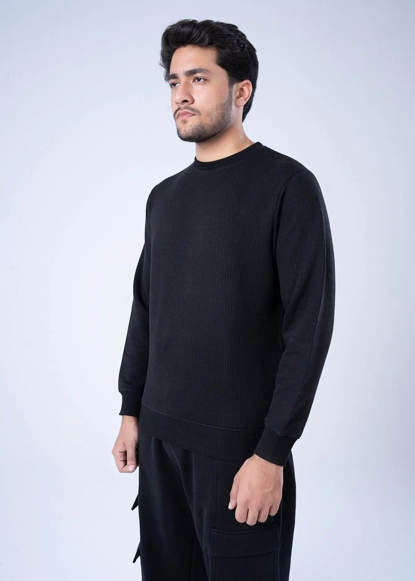 Black waffle-knit crewneck sweatshirt with ribbed cuffs and long sleeves