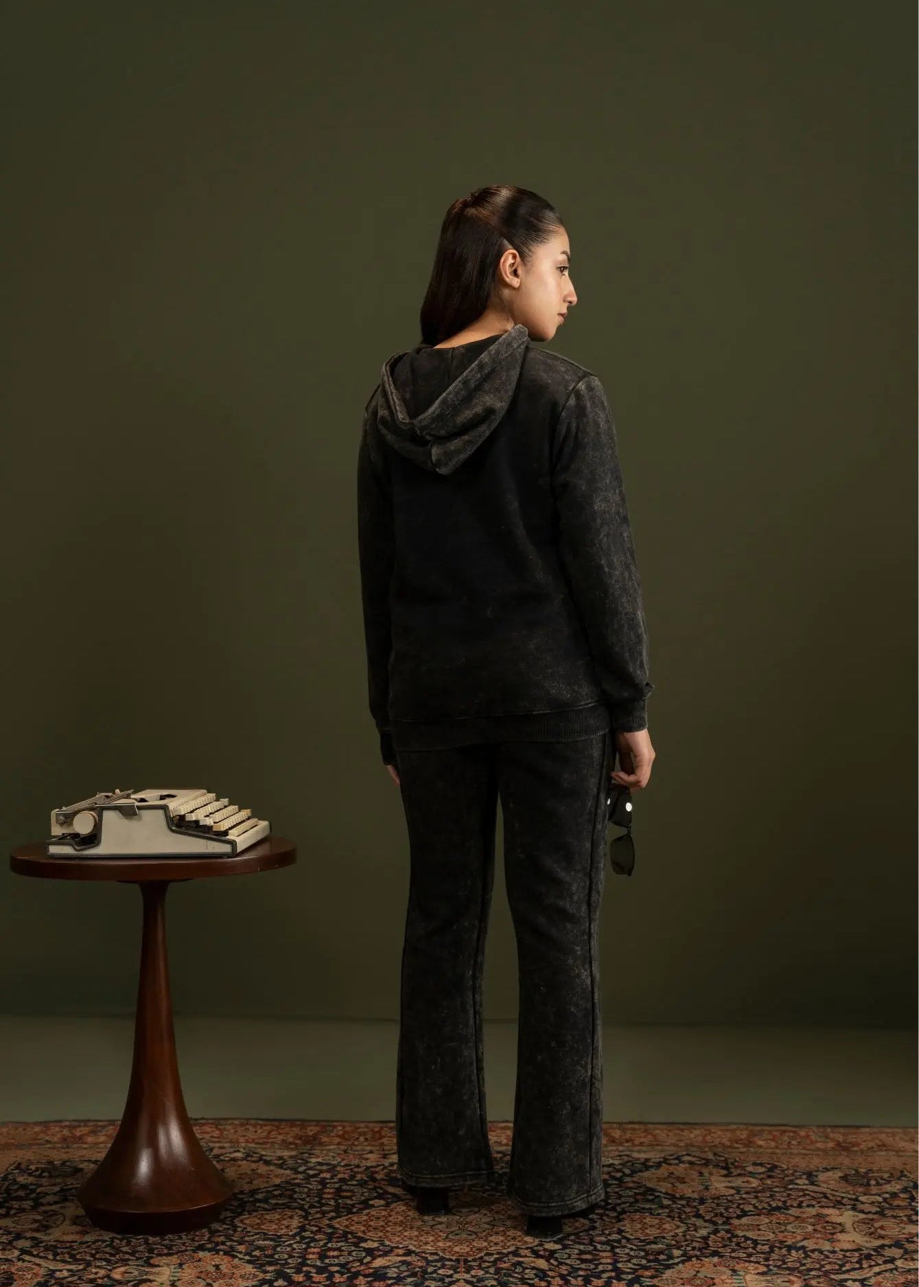 Men's black fleece hooded jacket and jogger pants, back view