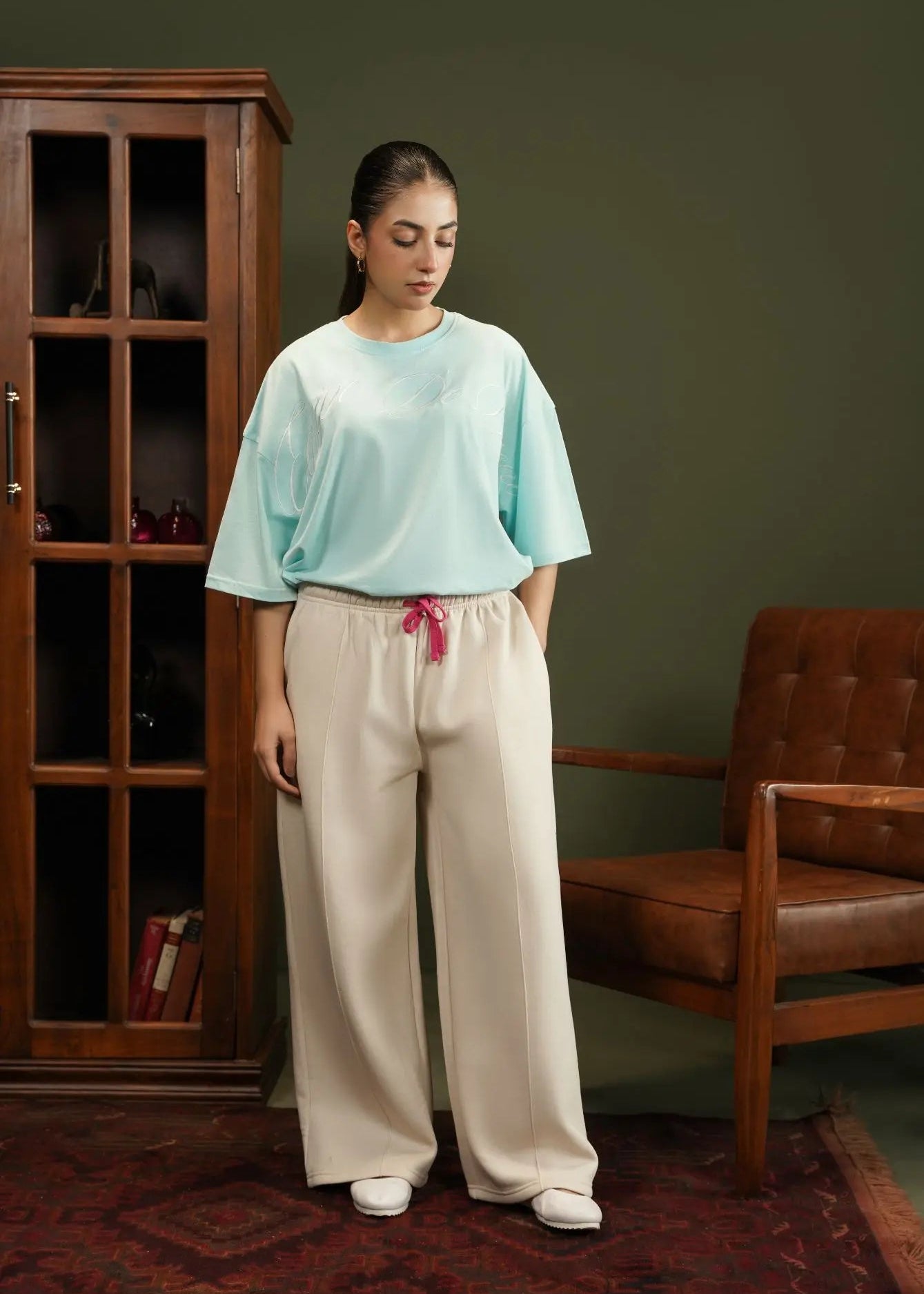 Men's fleece pull-on trousers in stone with elastic waist, drawstring, and wide legs