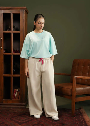 Men's fleece pull-on trousers in stone with elastic waist, drawstring, and wide legs