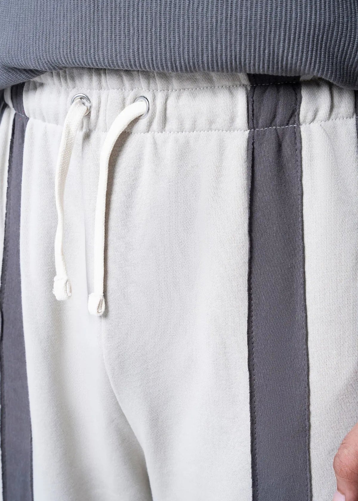 Drawstring waist pull-on trousers with terry texture, off-white and charcoal panels