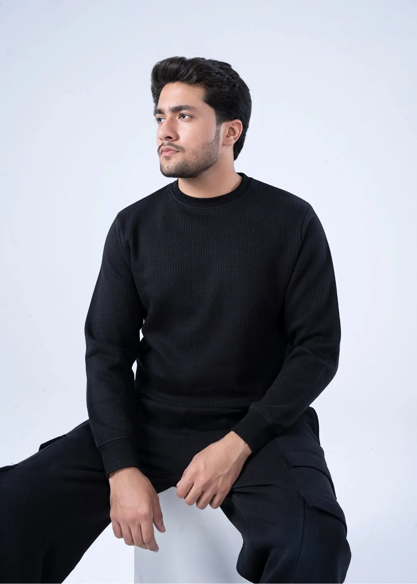 Black waffle-knit crewneck winter sweatshirt with long sleeves