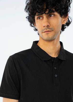 Men's black cotton pique polo shirt close-up of collar, button placket detail