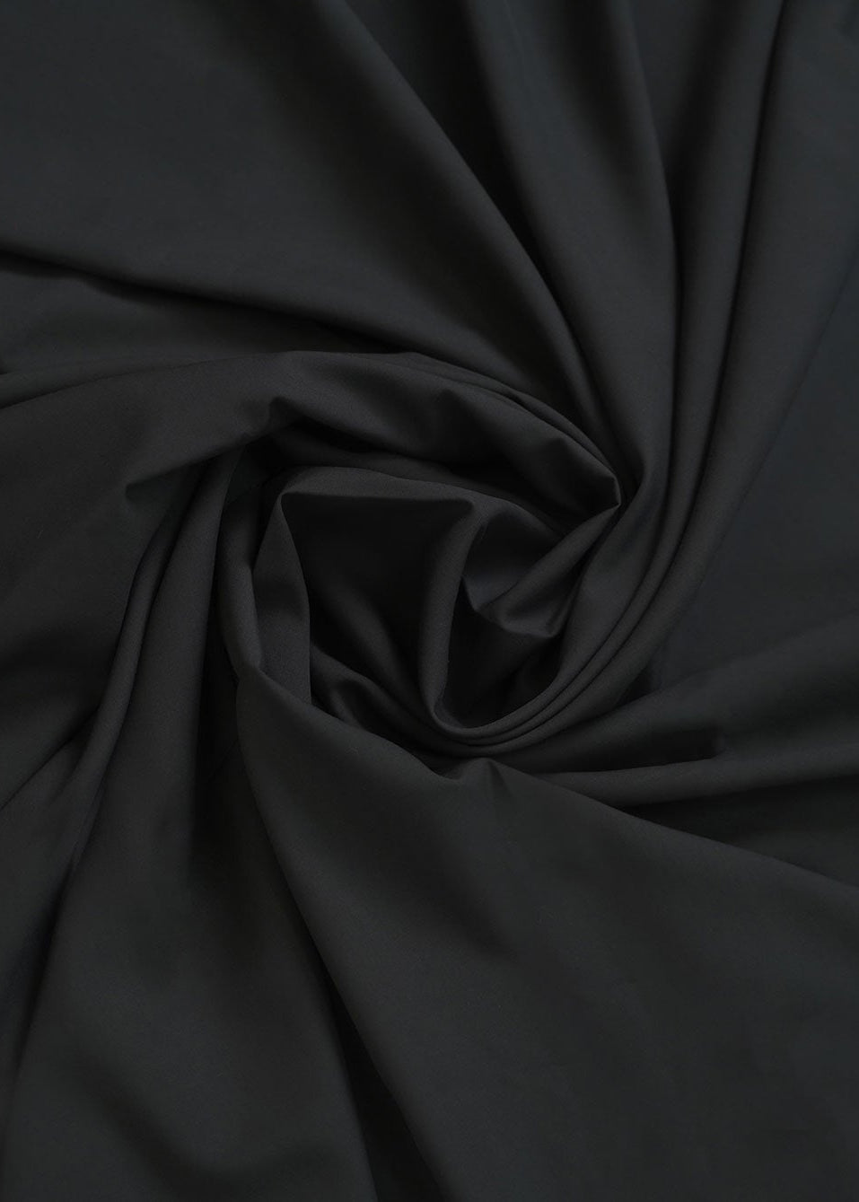 Black dobby fabric with soft, draped texture
