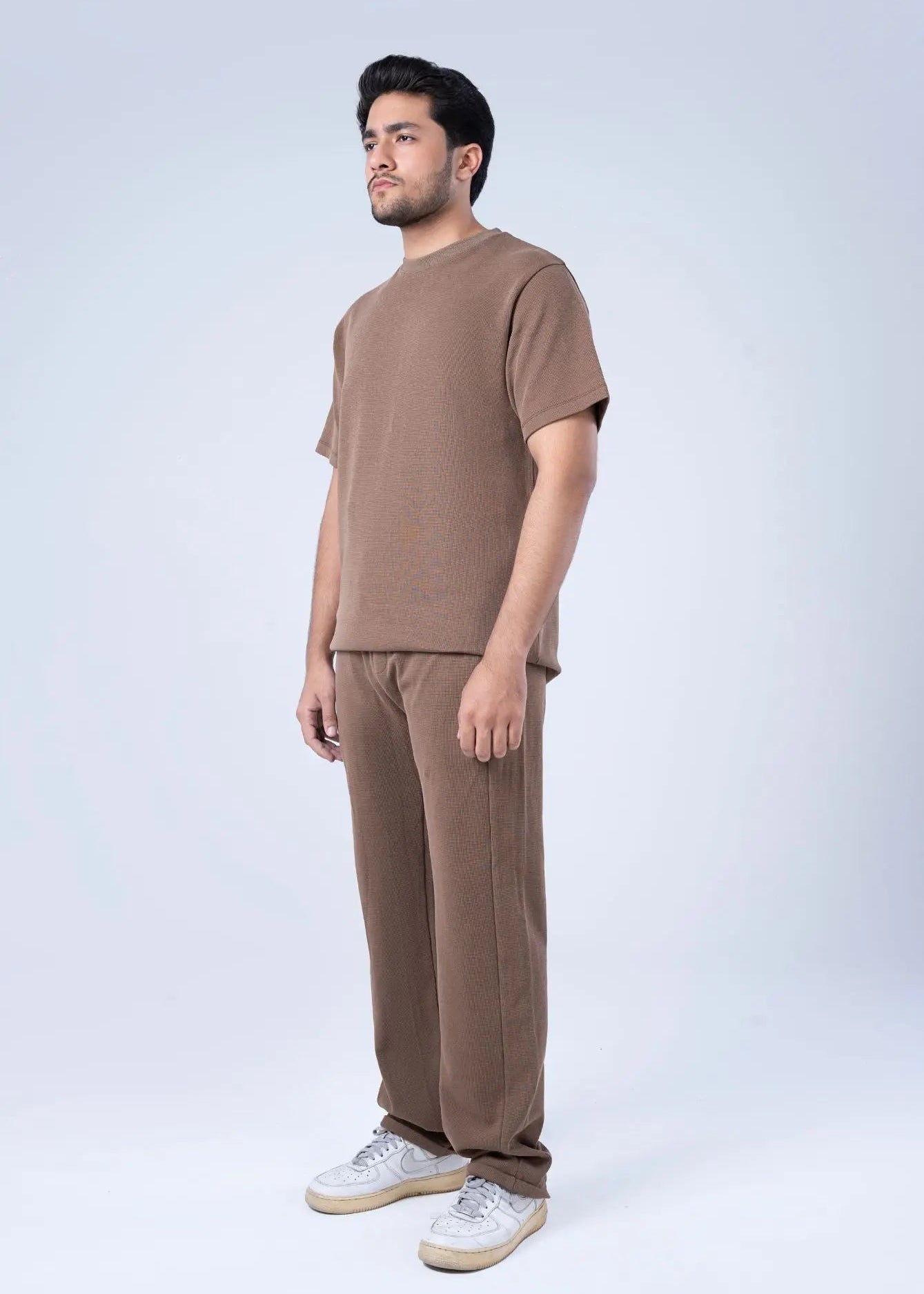 Men's winter pull-on trousers in brown waffle knit, straight-leg with elastic cuff.