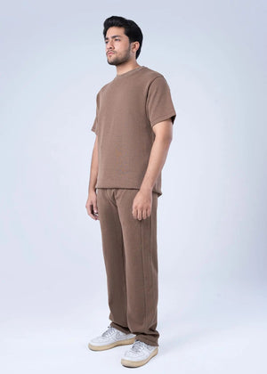 Men's winter pull-on trousers in brown waffle knit, straight-leg with elastic cuff.