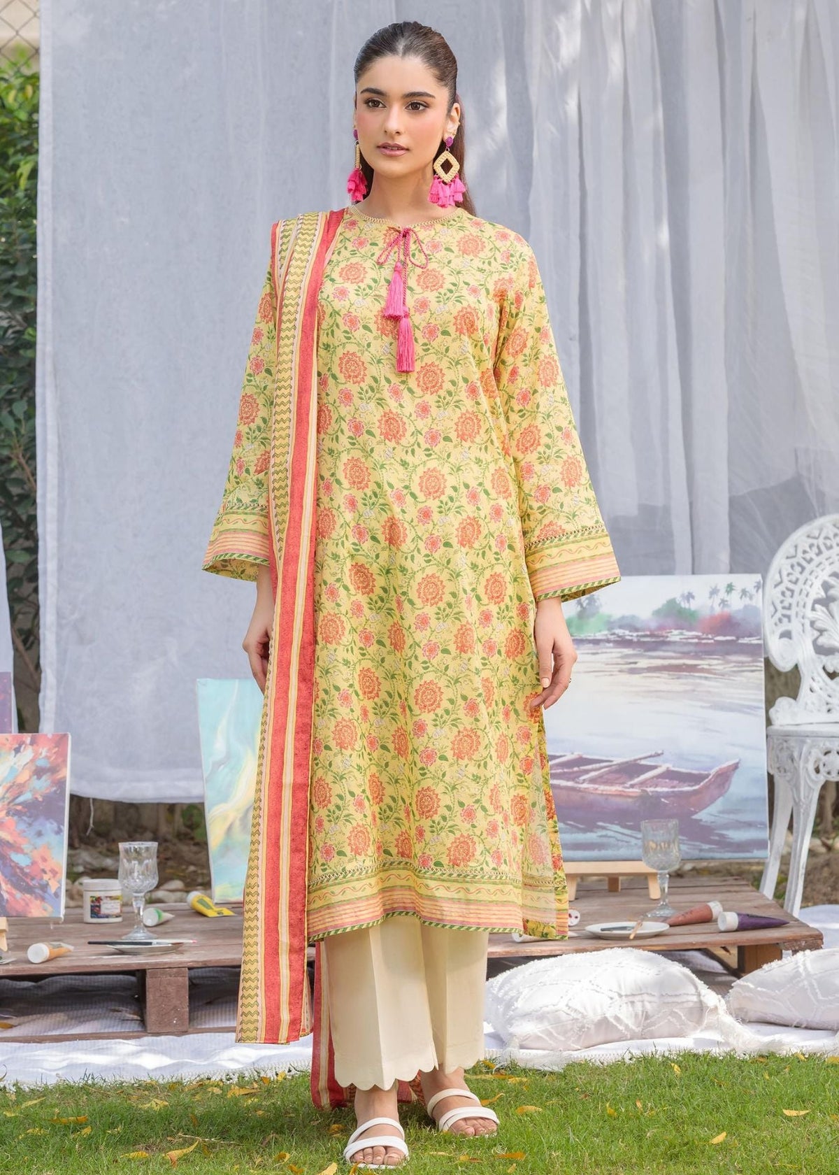 Yellow floral cotton lawn kurta with bow-tie neckline and cuff trim; paired with white pants