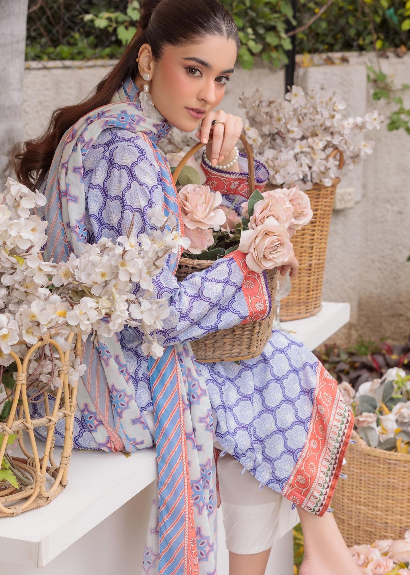 Lilac patterned long kurta suit with embroidered cuffs, paired with white pants