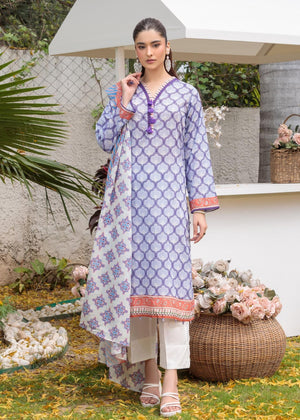 Lilac printed tunic with orange-and-blue trim, worn with white cropped pants