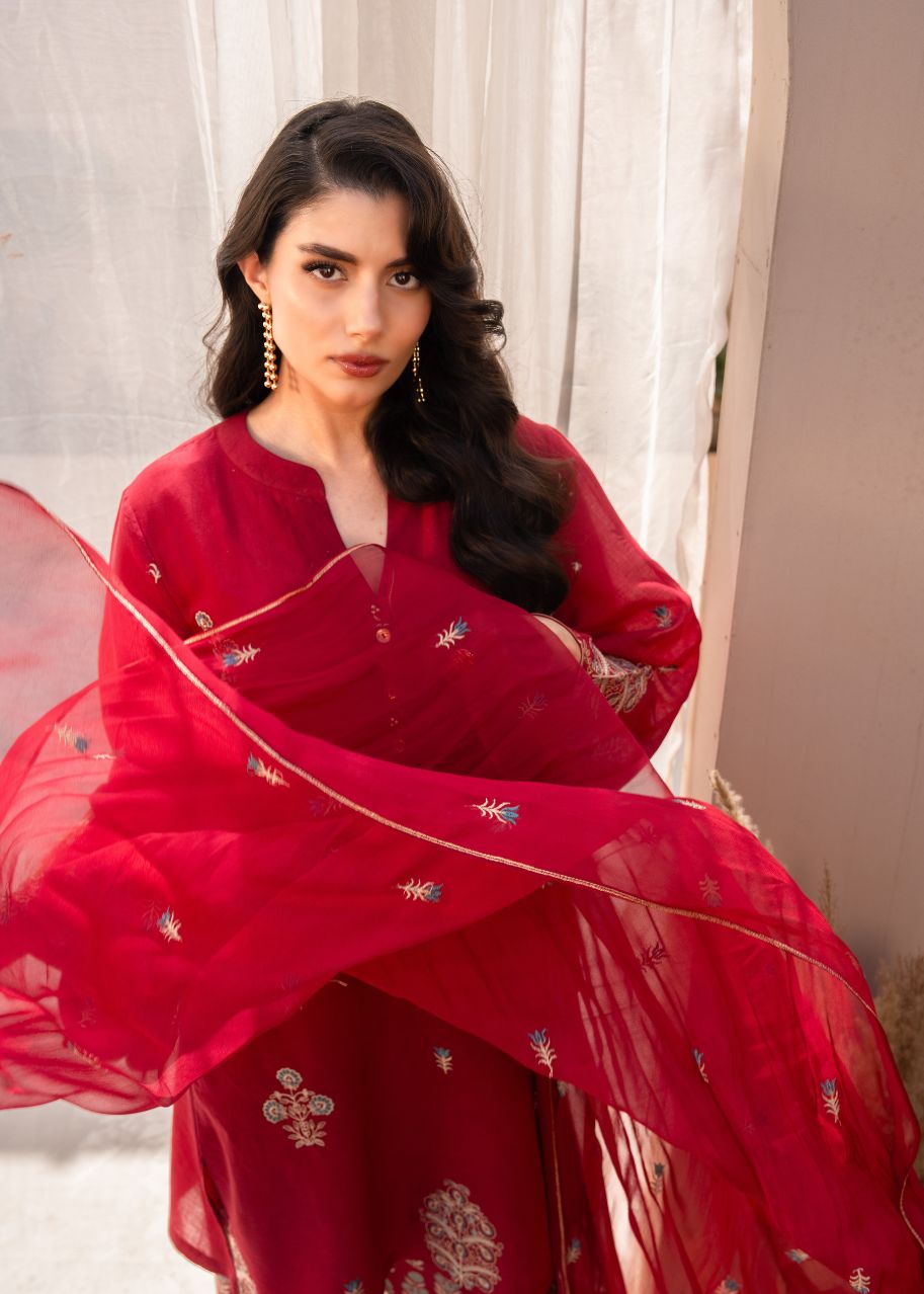 Women's maroon embroidered 3-piece set with sheer dupatta draped, front view