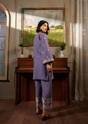 Women's purple embroidered tunic and pants set, side profile with cuff detailing