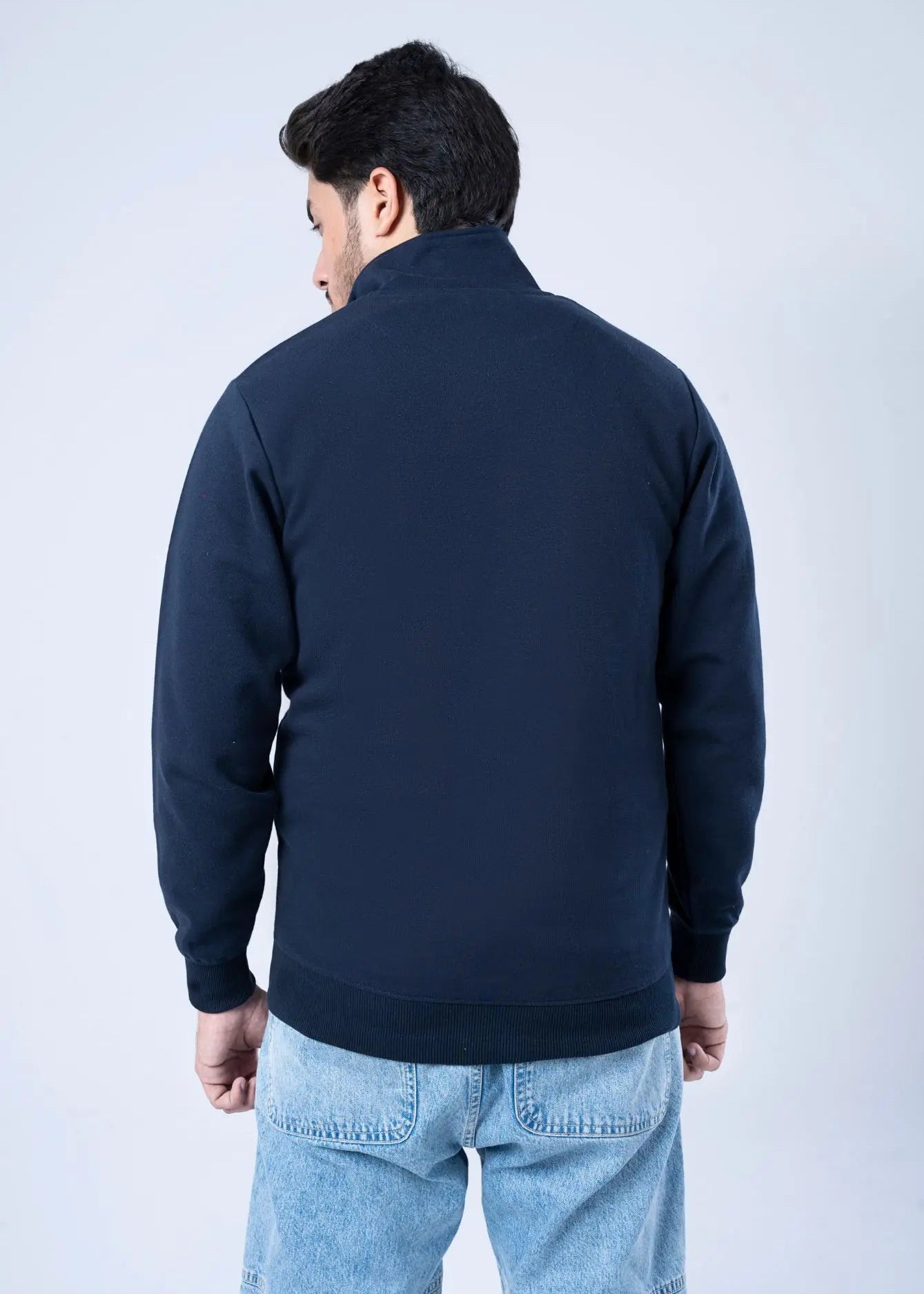 Men's navy fleece zip-up hoodie, plain back view with ribbed cuffs